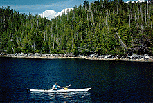 Photo of Park ranger kayaking away